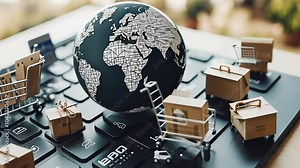 Exploring the Impact of E-Commerce on Global Trade With Mini Shopping Carts on a Laptop Keyboard