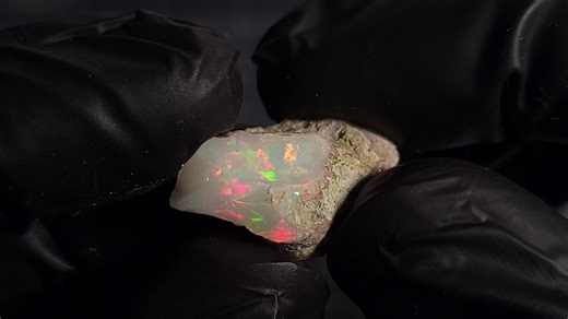 Opal, renowned for its mesmerizing play-of-color and captivating allure, holds a unique place among gemstones. In this detailed exploration, we will delve into the rich history, diverse properties, various types, cultural significance, and proper care of opals, highlighting their enduring charm and universal appeal. Origins and Properties Opal's origins can be traced back millions of years to the geological processes of the Earth. It forms when silica-rich water seeps into cavities and fissures,