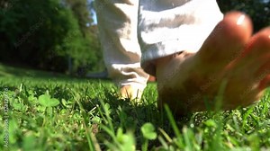 Man walks barefoot in nature slow motion. Feeling of freedom and joy.