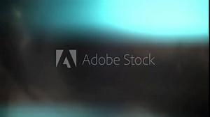 Light blue lens flare flicker at the black background in the studio. Optical light effect is gleaming in a beautiful way. The conception of light transitions for filmmakers' use.