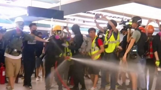 Hong Kong protesters clash with riot police in subway demonstration