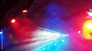 The result of work of lighting engineer at a concert. Soffits, ramp, blinder, parabolic aluminum reflectors. Multi-colored highlights and rays shine alternately. Lighting design for the concert stage