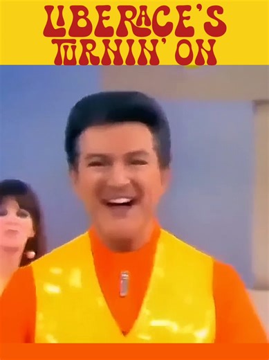 LIBERACE taps into the youth market with 1968's performance of the flower power feel-good hit