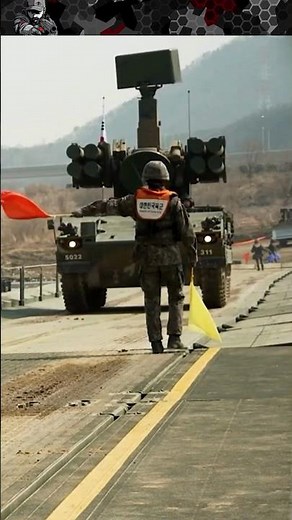 Flag Signals to Guide Tanks Across Floating Bridge