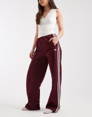 adidas Originals Firebird loose track pants in maroon and off white | ASOS