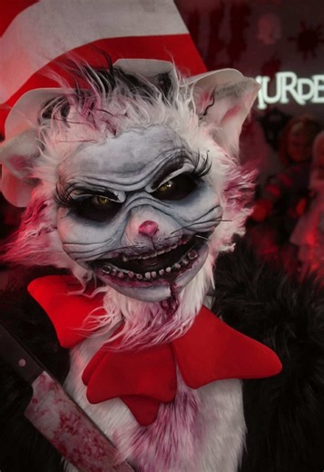 CAT in the HAT 🐈‍⬛ I made the mask using foam clay and made the jaw separate so it could move 🖤 @Makeup A Murder, INC. COD liquid eyeshadows matte white and black blended into the mask and KOD 🩸 lip stain Fatal Attraction for 🩸 @Roligore inspired me to use teeth!! Her work is INSANE and we all know it 🖤 @EldoraFalseEyelashes B802 Lashes and @SHOP NAILZ BY DEV @NAILZ BY DEV 💅🏼 NAIL ARTIST Uv Gel Polish to make the whiskers @TTDeye Colored Contact Lens Eynxt Brown Contacts #catinthehat #cat