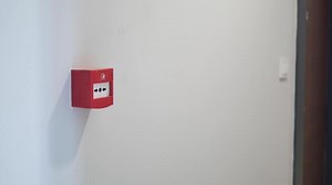 Download Red fire alarm button on wall , for free