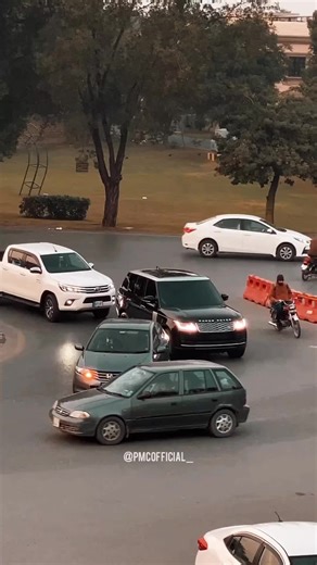 Motorcycle Weaving Through Busy Roundabout Story