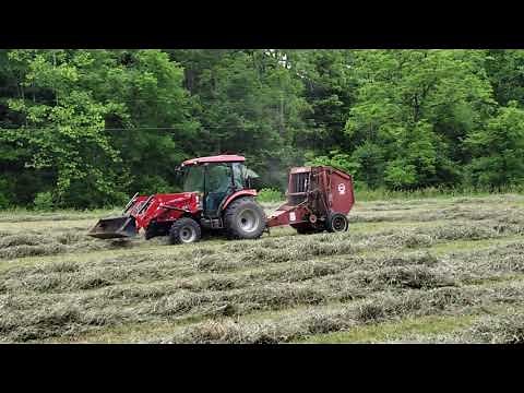 Rural King RK55 baling hay with Hesston 5530 baler