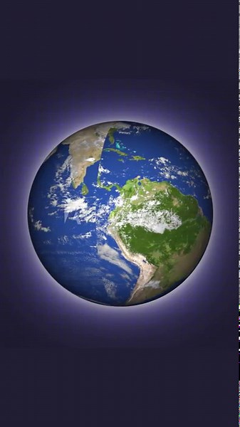 Vertical video of spinning world globe animation. 3d rendered animated rotating earth globe showing south america and surrounding oceans. Digital animation of rotating world globe.