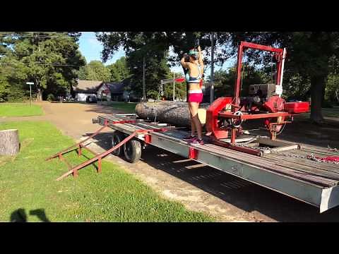 100 lb women lifts 1200 lb log onto Sawmill