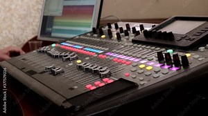 Remote control for adjusting the sound. Audio mixer. Sound engineer adjusts the sound. Music Festival. Change the volume level. Recording studio. Shooting a television show, a concert. Live broadcast
