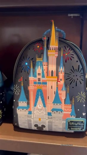 Disney Fashionista on Instagram: "A portable Happily Ever After! 🎆🎇 Cinderella Castle light up fireworks @loungefly for $90 #disneyloungefly #happilyeverafter #cinderellacastle"