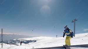Slow motion of a skier doing incredible ski jumping of a slope