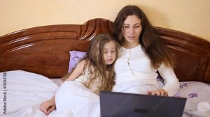 Mom and daughter at the computer