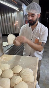 Epic middle eastern bread making in the oven new 🍞 #bakingprocess #foodshorts #breadmaking #freshbread #tandoor #artisanbaking #traditionalbaking | This Bakery I