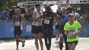 NYC Marathon Runners Help Man Across Finish Line