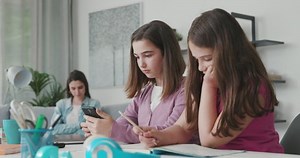 Young Girls Sitting Desk Home Connecting Stock Footage Video (100% Royalty-free) 1074584561 | Shutterstock