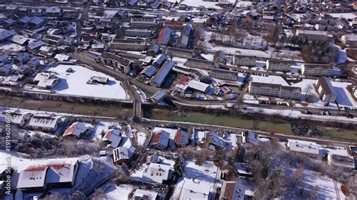 Winter in Mittenwald, Upper Bavaria. Aerial view of the Isar river flowing through the snowy Werdenfelser Land. Surrounded by Karwendel and Wetterstein peaks near the border to Oesterreich