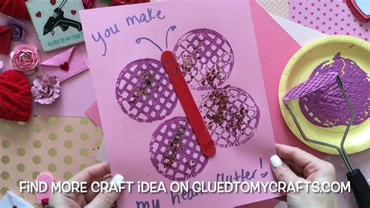 🦋✨ Who knew a potato masher could create such beautiful butterflies? This fun and easy craft is perfect for kids to explore their creativity and make something magical! 🥔🎨💕 Show us your stamped butterfly masterpieces! 🖌️ #kidscrafts CRAFT SUPPLIES NEEDED: Cardstock Paper {I used a shade of pink} Potato Masher Craft Paint {I used a shade of purple} Loose Craft Glitter Small Paper Plate Jumbo Craft Stick School Glue Marker DIRECTIONS: Begin by squirting a generous amount of craft paint into t