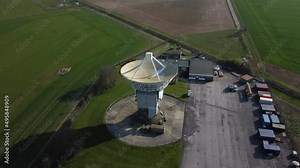 Top down aerial birds eye view shot of observatory with radar antenna
