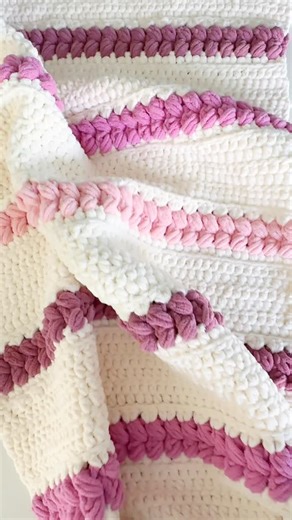 Erin || Free Crochet Patterns on Instagram: "❤️ This is the softest blanket ever!! I love the Braided Puff Blanket because the puffs gave a heart vibe, perfect for Valentine’s Day! Plus who doesn’t love a squishy blanket!! 🧶 @yarnspirations Bernat Blanket 🏷️ Tags @angieandbritt 👉🏻 Head to simplymadebyerin.com or tap the link in bio to grab the FREE pattern. 🏷️ Tag a crochet lover who’s ready for winter!! #freecrochetpattern #simplymadebyerin #crochetblanket #crochetbabyblanket #yesyarnspira
