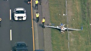 Plane clips vehicle during emergency landing on I-88