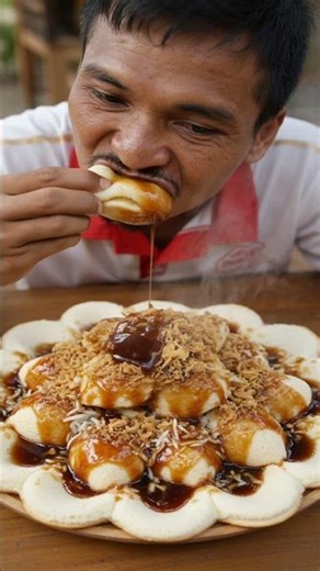 enjoying a traditional food called "CIMPLO" typical of Indramayu village, West Java, Indonesia