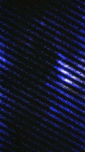 clip-4018424725-sparkling-blue-diagonal-lines-glow-against-black