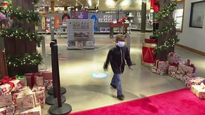 Kids visit Santa with face masks, plastic shields