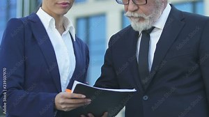 Assistant giving boss to sign contract or annual report, solving business issues