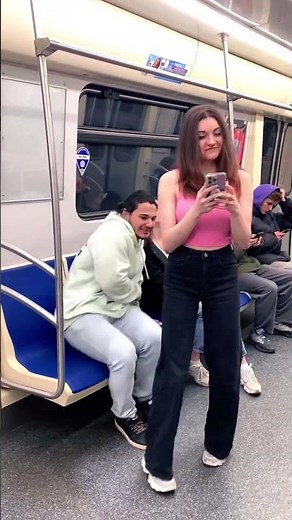Girl sitting accidentally on boys lap
