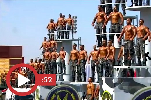 Shirtless Egyptian police graduated show of feats of strength