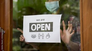 wear masks, keep your distance and wash hand sign on shop front door when new normal during coronavirus outbreak in the city