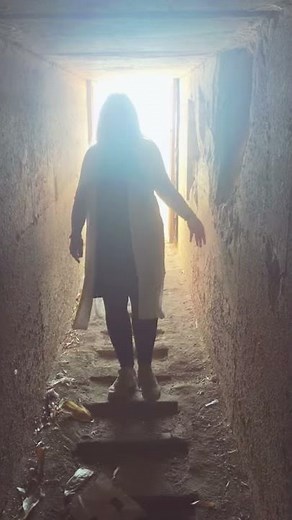 Entering the Pyramid of Hawara full of water, in Fayum, Egypt