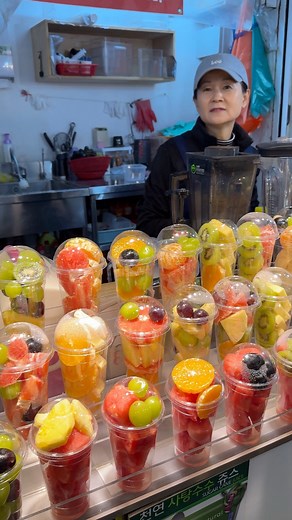 Fresh fruit cups bursting with color and flavor 🍓🍍🍇 Korean street market vibes #foryouシ #fypシ #viralvideoシ #fbreelsvideo #viralreels #StreetFoodVibes #FoodReels #Shorts | WOW FOODS