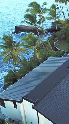 Voyager Roofing on Instagram: "Another Midnight Bronze standing seam roof wrapped up with aluminum fascia, seamless rain gutters and insulation in Portlock 🤙🏽🤙🏽"