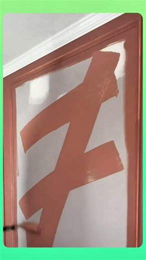 Painting a checkerboard pattern on wall, carefully aligning each square for a bold geometric design.