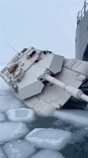 Tank falls through the ice