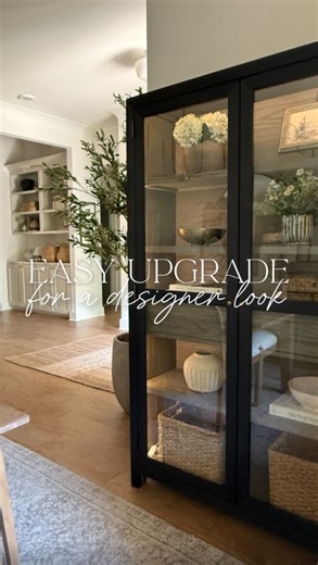 Melissa Coryell on Instagram: "Comment LIGHT for the link 💌 Loving how this Amazon find elevated and added warmth to my little black display cabinet! 😍 It comes with a remote control and is also dimmable. You just peel the tape off and stick it on! I also installed one behind our bedroom full length mirror a year ago. Comment LIGHT to get the link instantly delivered to your DMs! 💌 I just drilled a small hole in the bottom corner of the cabinet so the cord could slip through and be plugged in