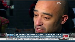 Woman trapped between 2 walls