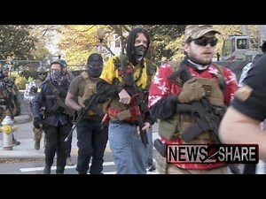 Militia activists march armed through Richmond, VA, where guns at protests are illegal