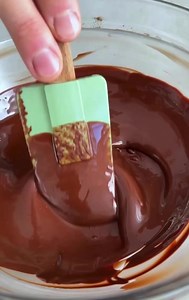 How to temper chocolate 🍫 Did you know that chocolate needs to be tempered? When you heat chocolate, you separate the fatty acid crystals inside the cocoa butter. If you simply let it cool down, the crystals will form unevenly, creating the change in texture and appearance. By adding pieces of solid chocolate to the melted chocolate, you lower the temperature while allowing the crystals to re-connect in an organized form. The temperature is then raised again very gently to keep the chocolate sm