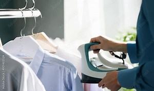 Expert Dry Cleaner Pressing a White Shirt