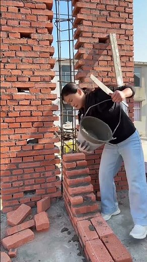 Craftsman Building A Wall With Red Bricks