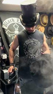 Handcrafted hybrid Fedora-Optimus Crown hat in blackened felt, featuring a heavily worn finished
