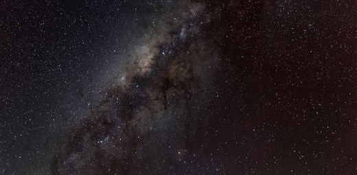 Why is space so dark even though the universe is filled with stars?