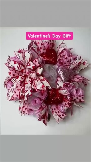 This beautiful Mother's Day Deco Mesh Wreath is sure to glam up your home for this Mother's Day! It’s made with white deco mesh with pink and red mesh curls. The wreath is embellished with hearts ribbons, sequined heart ornaments, and a gorgeous bow. The wreath measures 20 x 20 x 8 inches.