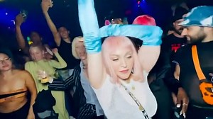 Madonna lets loose as she throws her arms around in a club