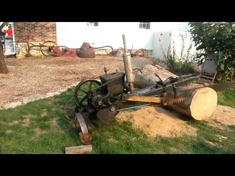 Antique reciprocating wood drag saw,hit and miss engine